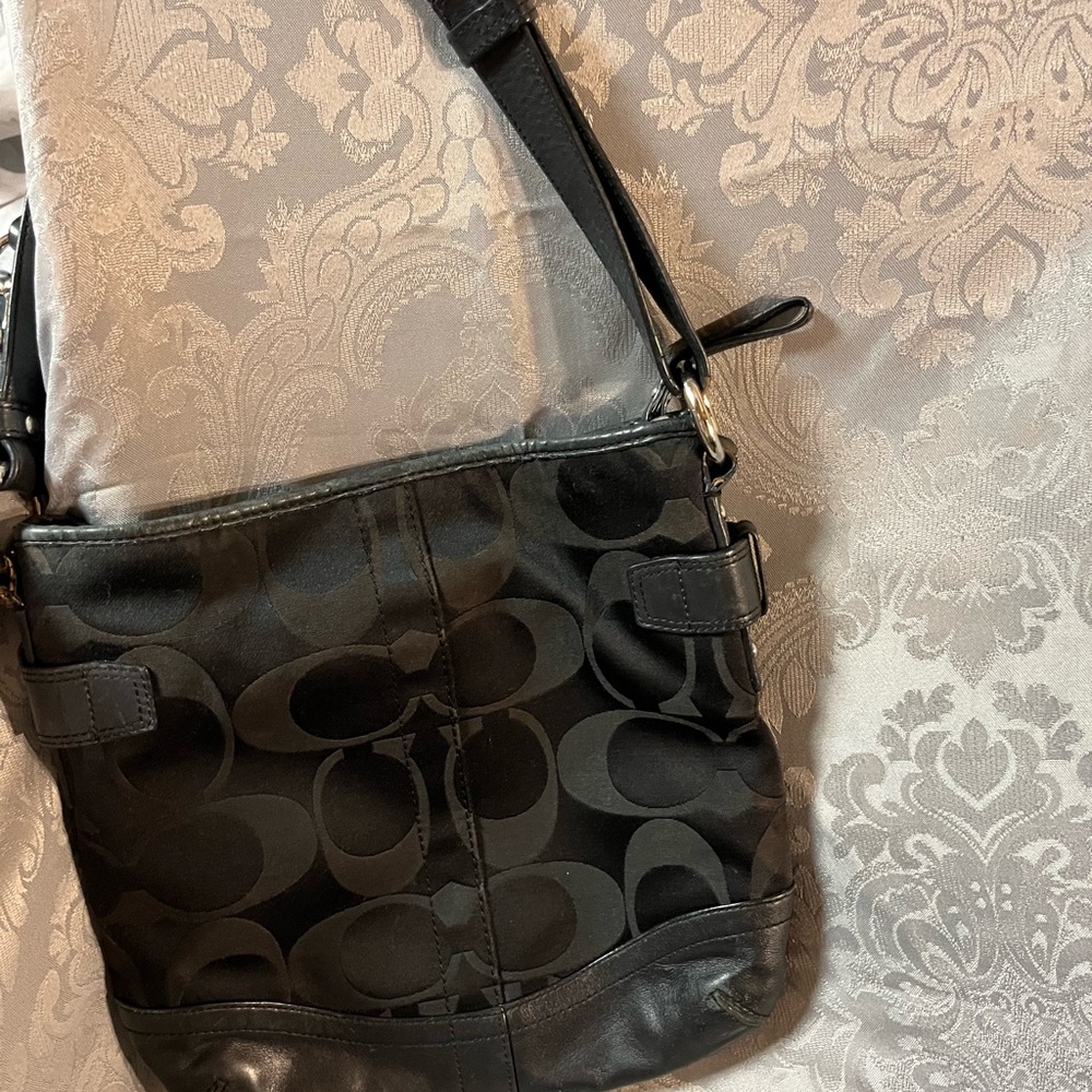 Coach monogram black fabric hand back with leather and silver accents